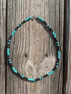 "ONE \"Sparrow\" Beaded Choker on 16\" or 12\" length This hand-beaded choker is a perfect addition to any punchy outfit. Perfect for rodeo days. The pattern features a turquoise & black pattern. Featuring a 1in extension chain to ensure it fits most neck sizes comfortably. If you would like a different length, please message me! I would love to help you design your perfect necklace. I am more than happy to customize any order. Please feel free to ask me any questions and/or concerns regardi Casual Black Beaded Necklace For Festivals, Adjustable Beaded Turquoise Necklace For Festivals, Southwestern Style Black Necklace For Festival, Handmade Western Turquoise Necklace For Festival, Casual Turquoise Beaded Necklaces For Festival, Black Southwestern Necklace For Festival, Turquoise Beaded Necklaces With Black Beads For Festival, Southwestern Black Beaded Necklaces For Festivals, Southwestern Style Black Necklace For Festivals