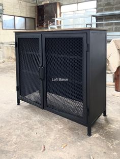 the large metal cabinet is empty in the warehouse