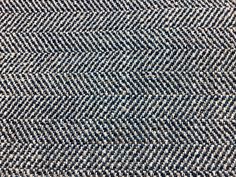 a blue and white herringbone pattern on fabric