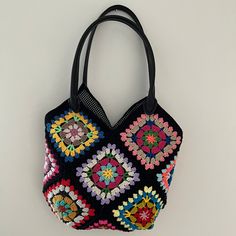 MADE TO ORDER  Introducing our exquisite Floral Crochet Tote Bag - a stunning blend of functionality and elegance! Handcrafted with meticulous attention to detail, this bag epitomizes artisanal mastery. 🌸 Intricate Design: Unlike the classic granny square motif, our bag features charming floral patterns against a sleek black backdrop. Each motif is delicately crocheted using premium cotton yarn, ensuring both durability and a touch of sophistication to your attire. 👜 Versatile Style: Designed Multicolor Rectangular Hobo Bag Gift, Handmade Black Bohemian Bags, Multicolor Crochet Tote Bag With Adjustable Strap, Multicolor Crochet Bucket Bag, Square Multicolor Hobo Bag With Handles, Handmade Black Crochet Handheld Bag, Multicolor Crochet Bucket Shoulder Bag, Multicolor Crochet Bag With Double Handle For Shopping, Multicolor Large Capacity Crochet Bucket Bag