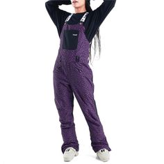 Planks Fun-Garees Bibs - Women's | evo Black Winter Snowboarding Bottoms, Purple Bottoms With Pockets For Winter, Purple Winter Bottoms With Pockets, Winter Purple Bottoms With Pockets, Full-length Bottoms For Winter Outdoor Activities, Full Length Bottoms For Winter Sports, Full Length Winter Sports Bottoms, Casual Black Pants For Snowboarding, Casual Black Snowboarding Bottoms