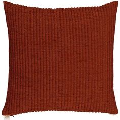 an orange pillow with ribbings on the front and back, against a white background