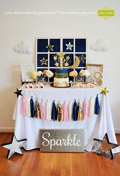 a table that has some cake on it and stars around the table in front of it