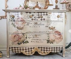 an ornate dresser with roses and other decorations