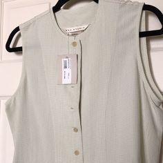 Max Studio Sleeveless Partially Buttoned Down Top In A Small Pale Green Check Print. Small “Aged” Mark On The Bottom Front (See Photo) From Being In Closet/Time Nwt Never Worn Classic Shirt Short In Length. Not Cropped, But Not Long. Classic Spring Vest, Classic Sleeveless Blouse Tank Top For Spring, Classic Sleeveless Tank Top For Spring, Classic Sleeveless Summer Vest, Classic Sleeveless Tank Top For Summer, Classic Sleeveless Summer Tops, Classic Sleeveless Vest For Daywear, Classic Sleeveless Tops For Spring, Classic Sleeveless Tank Top For Daywear