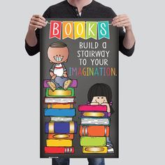 a man holding up a poster with books on it