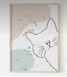 a painting with a cat's face on the wall next to a white wall