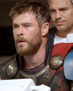 two men dressed as thor and captain america