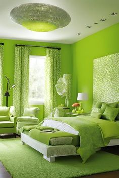 a bedroom with green walls and white furniture