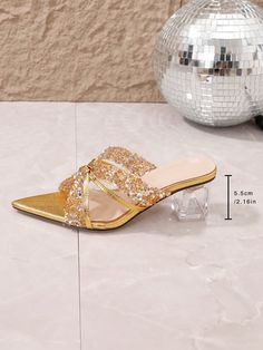 Step up your style game with our Glamorous Rhinestone Sandals! Featuring pointed toes and high heels, these sandals will elevate your look to the next level. The rhinestones add a touch of glamour, making them perfect for any occasion. Turn heads and feel confident with every step in these stunning sandals. Color : Gold Pattern Type : Plain Heel Height : Mid Heel Upper Material : PVC Lining Material : PU Leather Insole Material : PU Leather Outsole Material : PVC Party Sandals With Rhinestones And Single Toe Strap, Party Heels With Rhinestones And Single Toe Strap, Pointed Toe Synthetic Sandals For Prom, Gold Pointed Toe Sandals With Rhinestones, Gold Rhinestone Pointed Toe Sandals, Rhinestone Pointed Toe Party Sandals, Party Sandals With Rhinestones And Pointed Toe, Glamorous Synthetic Heels With Single Toe Strap, Sparkling Pointed Toe Party Sandals