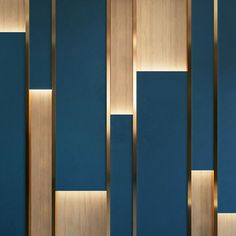 a blue wall with wooden paneling and lights