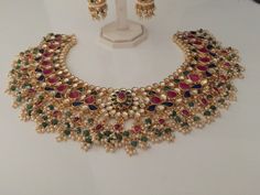 Luxury Multicolor Kundan Necklace For Ceremonial, Luxury Yellow Gold Kundan Necklace For Reception, Luxury Yellow Gold Kundan Necklace For Celebration, Multicolor Stone Work Jhumkas For Wedding, Heavy Multicolor Bridal Sets For Festive Occasions, Heavy Multicolor Bridal Sets For Wedding, Multicolor Kundan Jhumkas For Wedding, Multicolor Kundan Hand Set Bridal Sets, Multicolor Hand Set Kundan Bridal Sets