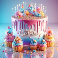 a birthday cake surrounded by cupcakes and sprinkles with lit candles