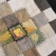 a close up of a patchwork quilt