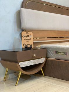 a bed with a wooden frame and mattress on it