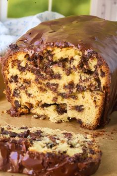 a loaf of chocolate chip bread with one slice cut out and the rest half eaten