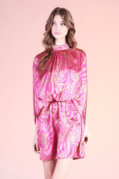 Add a little spice to your formal wear with our Frida Luxe Satin Mock Neck Caftan Mini Dress. This print is beautiful and gives the perfect touch of color to the closet. The dress pulls over the body and secures with a tie behind the neck. The waist is elastic to keep the body in place from day to night. Pair with minimal accessories and neutral shoes. SKU #: D-7931 Chic Party Dresses With Elastic Neckline, Chic Party Maxi Dress With Elastic Neckline, Chic Maxi Dress With Elastic Neckline For Party, Spring Party Dress With Elastic Neckline, Elegant Flowy Printed Mini Dress, Chic Floral Print Tie Neck Dress, Elegant Printed Pink Dresses, Elegant Long Sleeve Dress With Elastic Neckline, Elegant Pink Mini Dress With Tie Waist