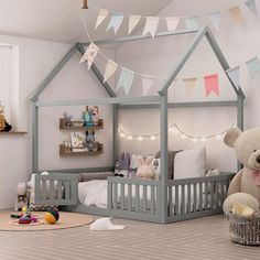 a child's bedroom with a teddy bear sitting on the floor