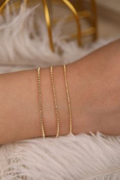 14k Gold Ball Chain Bracelet, Solid Gold Bracelet, Yellow Gold Dainty Chain, Bracelet Stack, Dainty Gold Bracelet, A Great Gift, Selena Wear it by itself or stack them up with your other bracelets ⁕⁕ Handmade ⁕⁕ Solid Gold ⁕⁕ Chain Width : 1mm - 1.3mm - 1.5mm ⁕⁕ High-End Polish Orders with free shipping go out with USPS First Class Mail tracking. We require a signature for orders more than $500. If you need a signature required service, you can select that service in the shipping options on your Dainty Chain Bracelets For Wedding, Elegant Chain Bracelet With Round Beads As Gift, Elegant Beaded Chain Bracelet As Gift, Elegant Beaded Chain Bracelet For Gift, Elegant Bracelet With Satellite Chain As Gift, Elegant Satellite Chain Bracelet As Gift, Elegant Chain Bracelets For Jewelry Making, Elegant Beaded Bangle Bracelets, Elegant Party Bracelets With Beaded Chain