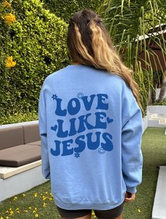 Love Like Jesus Sweatshirt Christian Sweatshirt Christian Apparel Trendy Hoodie Christian Hoodie Christian Gift Aesthetic Christian Clothes FUN FACTS ☼ Unisex Adult Sizes ☼ 50% Cotton; 50% Polyester ☼ Washer & Dryer Safe ☼ Pre-shrunk ☼ 3 Color Options SIZING ☼ Please check the sizing guide listing photo before purchasing ☼ IF YOU WOULD LIKE AN OVERSIZED FIT, BE SURE TO ORDER 1-3 SIZES UP SHIPPING ☼ Each of our items are made with love for each of our buyers. Items will ship in 1-7 business days Blue Long Sleeve Hoodie With Text Print, Relaxed Fit Text Print Hoodie For Loungewear, Trendy Blue Sweatshirt For Leisure, Trendy Crew Neck Hoodie With Lettering, Band Merch Long Sleeve Sweatshirt With Slogan, Band Merch Long Sleeve Letter Print Sweatshirt, Crew Neck Hoodie With Slogan For Loungewear, Blue Letter Print Sweatshirt For Leisure, Long Sleeve Hoodie With Slogan For Loungewear