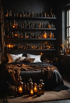 a bed with lots of candles on it in front of a wall full of bottles