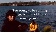 two people sitting on the edge of a body of water with a quote written above them