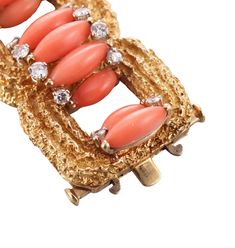 Exquisite 18k gold vintage 1960s bracelet, set with coral and approx. 3.00ctw VS-SI1/H diamonds. DESIGNER: Not Signed MATERIAL: 18k Gold GEMSTONES: Diamond, Coral DIMENSIONS: Bracelet is 6.75" long and 22mm wide. MARKED/TESTED: 18k, E65. WEIGHT: 86.2 grams CONDITION: Previously Owned/Excellent Condition Vintage Coral Jewelry For Anniversary, Luxury Coral Jewelry For Formal Occasions, Coral Vintage Jewelry For Anniversary, Elegant Coral Jewelry For Anniversary, 1960s Bracelet, Sign Materials, David Webb, Coral And Gold, Selling Jewelry