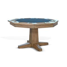 a wooden table with a black top and blue glass in the center on an isolated white background