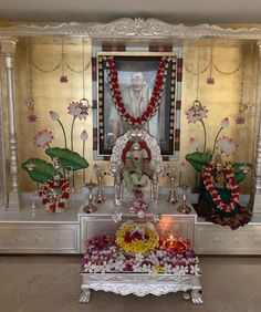 the shrine is decorated with flowers and garlands