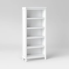 a white bookcase with three shelves on each side