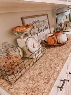 the kitchen counter is covered with cookies and pumpkins