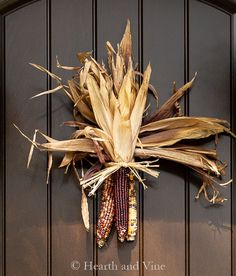 corn on the cob hanging from a door