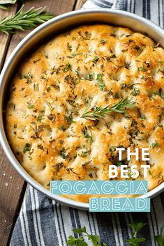 the best focaccia bread recipe in a pan with fresh herbs on top