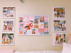 a bedroom with pictures on the wall and pink pillows in front of it, along with a white bed