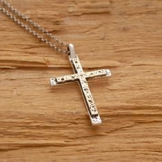 Share the spirit of faith with someone you hold dear. This 14 karat gold and sterling silver double cross necklace is a fitting gift for someone special on your gift list. It features two crosses, one made of sterling silver and one made of 14 karat gold, that have been hand-designed and melded together in a harmony of design. Suspended from a sterling silver chain or black leather cord with silver clasp and endings, makes a gorgeous accessory that can be worn every day or reserved for those spe Sterling Silver Cross Necklace For Baptism, Sterling Silver Cross Necklace For Wedding, Gold Sterling Silver Cross Necklace For Anniversary, Sterling Silver Cross Charms For Anniversary, Sterling Silver Cross Jewelry For Anniversary, Sterling Silver Cross For Anniversary, Engraved Cross Necklace For Anniversary, Spiritual Crucifix Cross Necklace For Anniversary, Spiritual Sterling Silver Cross Necklace For Anniversary