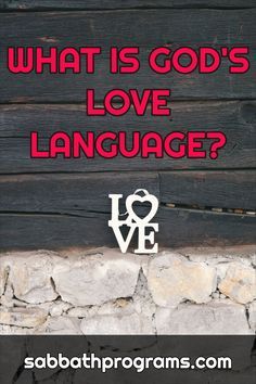 the words what is god's love language written in red on a stone wall