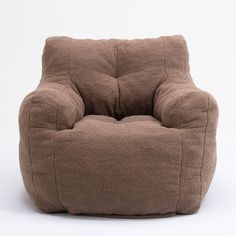 a brown bean bag chair sitting on top of a white floor