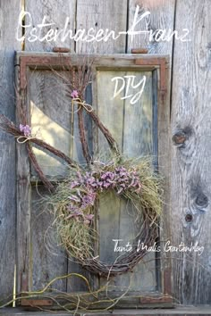 an old door with a wreath on it and the words between klons diy