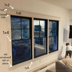 an image of a living room with windows and measurements for the height of the window