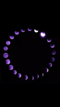 the moon is in the middle of a circle with purple lights on it's sides