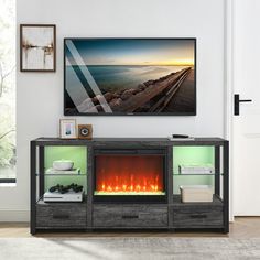 an entertainment center with a fireplace in the middle