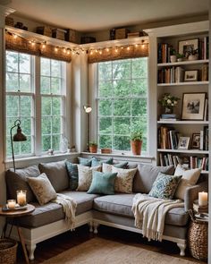 a living room filled with lots of furniture next to a window covered in bookshelves