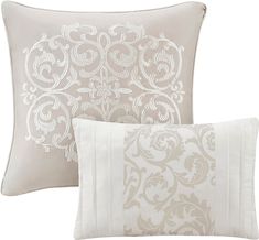 two pillows with decorative designs on them, one in white and the other in beige