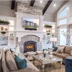 a living room filled with furniture and a fire place in the middle of a room