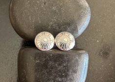 These modern mini conchos are .925 solid sterling silver and are slightly domed. These stud earrings are lightweight and an easy pair of go-to studs that will go with everything. These conchos measure 11mm and are finished with medium weight sterling silver butterfly backs. Because they are slightly domed, I make longer posts and solder at the center of the backside.  After soldering, earrings are oxidized (at your request) or left shiny and tumbled for strength and shine. Images shown are shiny. These are so cute.  The photos are enlarged to show all the details.    ~~ All jewelry from The Black Lotus Jewelry Co. will arrive securely packaged in a gift box with a lovely ribbon. Perfect for gift giving or a wonderful treat for yourself! Thank you for supporting my little shop and handmade. Silver Concho Earrings As A Gift, Silver Concho Earrings For Gift, Decorative Silver Earrings As Gift, Silver Southwestern Round Earrings, Elegant Concho Earrings For Gift, Concho Earrings, Dome Earrings, Black Lotus, Lotus Jewelry