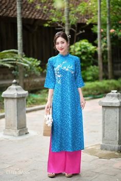 Our Gấm Collection Áo Dài is a fusion of delicacy and comfort. Made with luxurious Gam silk and is available in a size-inclusive range, this collection Áo Dài offer versatility, effortlessly transitioning from season to season.  ❣️ This set includes one Ao Dai Top and  Pants Style: Traditional  Material: Gam Silk. Little Stretch ❣️ This beautiful and modern ao dai set is perfect for any special occasions: Lunar NewYear, Mid Autumn Festival, Attending Wedding, or a Family photoshoot. ❣️ Please no Blue Embroidered Spring Pants, Traditional Blue Embroidered Pants, Traditional Embroidered Blue Pants, Traditional Wide Leg Spring Sets, Traditional Wide-leg Spring Sets, Traditional Embroidered Pants For Spring, Traditional Embroidered Spring Pants, Blue Cotton Bottoms With Embroidered Hem, Traditional Fitted Cotton Ao Dai