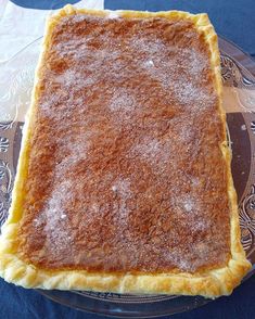 a pie sitting on top of a glass plate