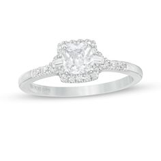 an engagement ring with a cushion cut diamond in the center