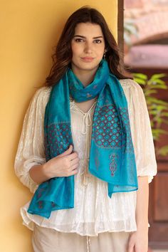 Designed from chanderi , a traditional Indian fabric crafted from cotton and silk, Isha Jain's exquisite shawl is lightweight with a fine, luxurious feel. Hand woven by Indian artisans, the cotton-silk shawl features a block-printed floral pattern in sapphire and cyan, while golden zari thread provides the final shimmering touch. Indian Fabric, Silk Shawl, Traditional Indian, Cotton Silk, Cotton Weaving, Fabric Crafts, Hand Woven, Design Details, Shawl