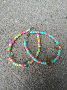 These bracelets feature bright colorful beads perfect for summer Turquoise Beaded Friendship Bracelets For Summer, Turquoise Friendship Bracelets With Colorful Beads For Summer, Multicolor Beaded Bracelets For Spring Vacation, Playful Multicolor Beaded Bracelets For Summer, Summer Turquoise Friendship Bracelets With Colorful Beads, Trendy Turquoise Beaded Bracelets For Summer, Spring Beach Bracelet With Colorful Beads, Colorful Beaded Jewelry For Spring Beach Occasions, Colorful Beaded Jewelry For Beach In Spring